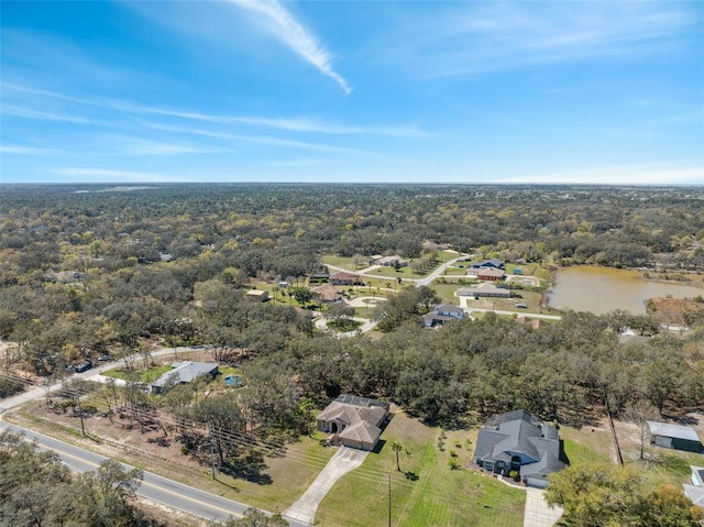 bird's eye view with a view of trees and a water view