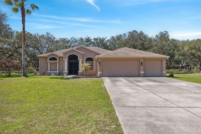 ranch-style house with stucco siding, an attached garage, concrete driveway, and a front yard