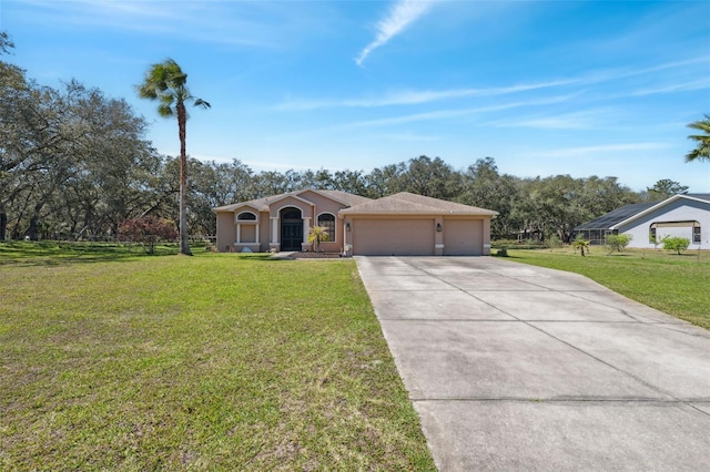 view of front of home featuring a garage, stucco siding, concrete driveway, and a front lawn