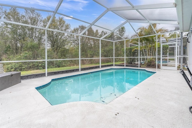 pool featuring a lanai and a patio area