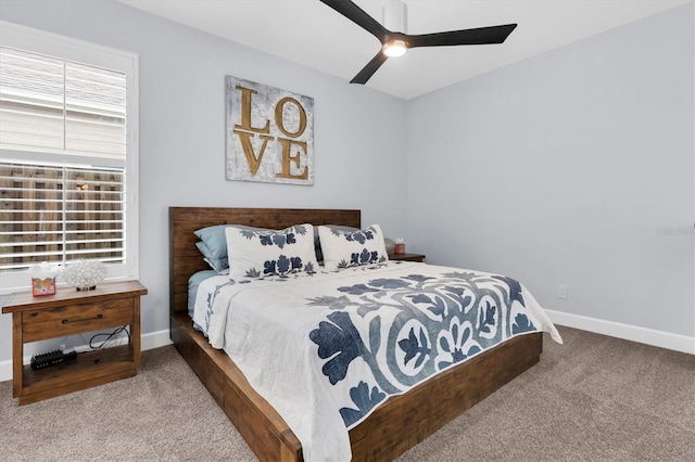 bedroom featuring baseboards, carpet floors, and ceiling fan