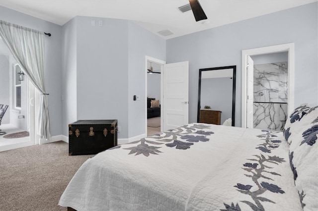 carpeted bedroom with visible vents, ceiling fan, ensuite bath, and baseboards