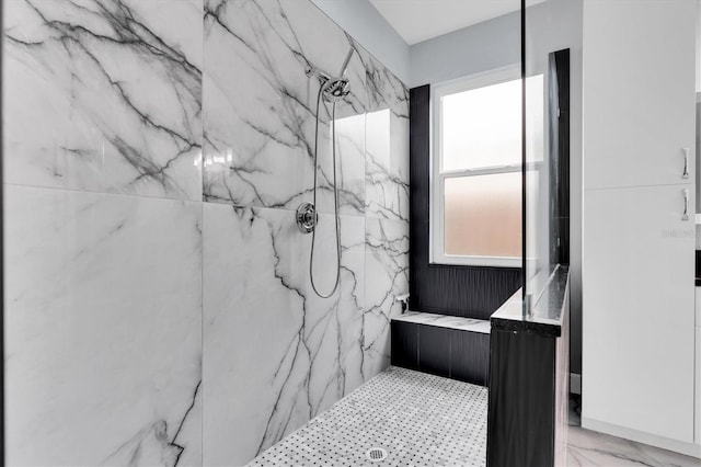 full bathroom with marble finish floor and a marble finish shower