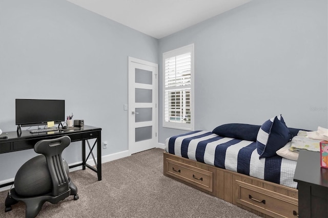 bedroom featuring carpet flooring and baseboards