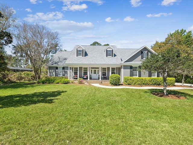 cape cod home with a porch and a front lawn