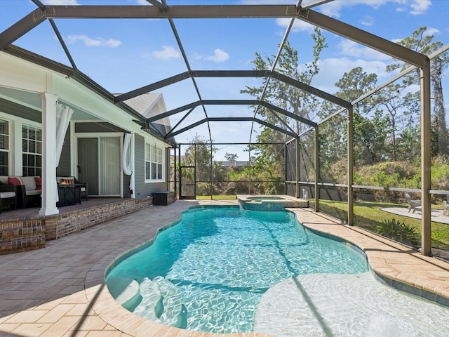 view of pool with a lanai and a patio area