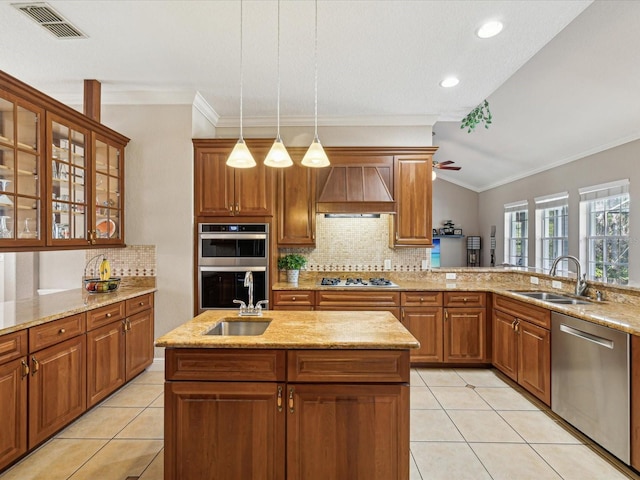 kitchen with light tile patterned floors, a sink, stainless steel appliances, and premium range hood