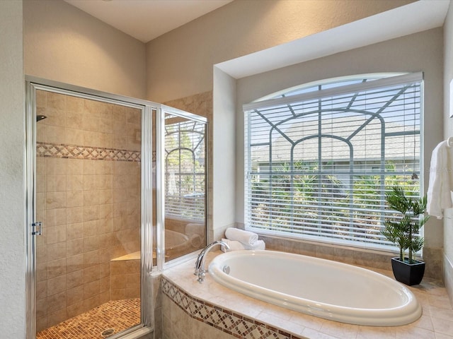 full bath featuring a shower stall and a garden tub