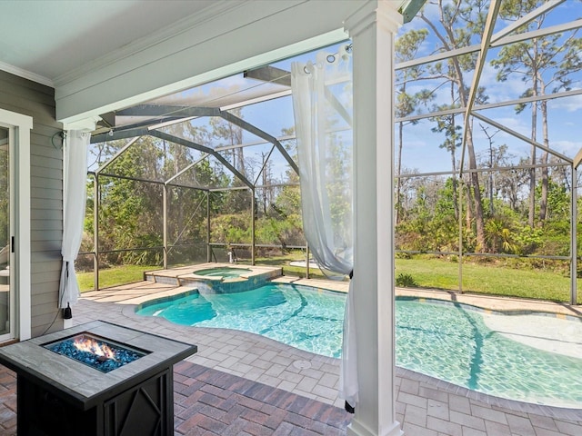 view of swimming pool featuring a lanai, a patio area, a pool with connected hot tub, and an outdoor fire pit