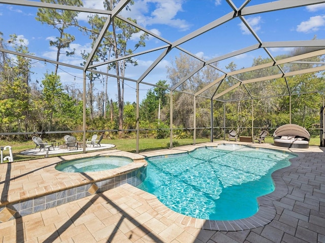 view of swimming pool with glass enclosure, a pool with connected hot tub, and a patio area