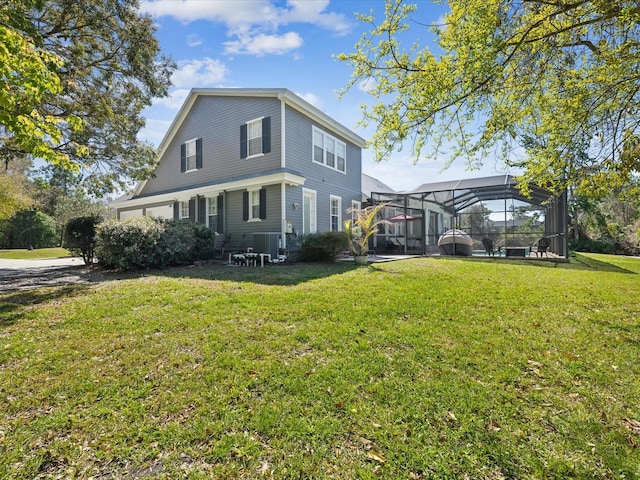 view of front of home with glass enclosure, cooling unit, and a front lawn