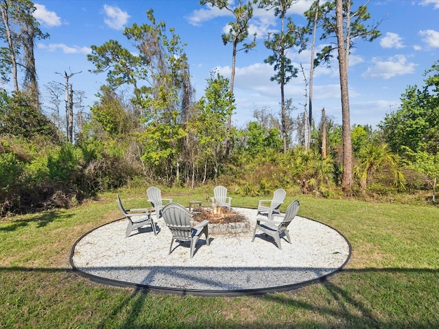 view of yard with a patio and a fire pit