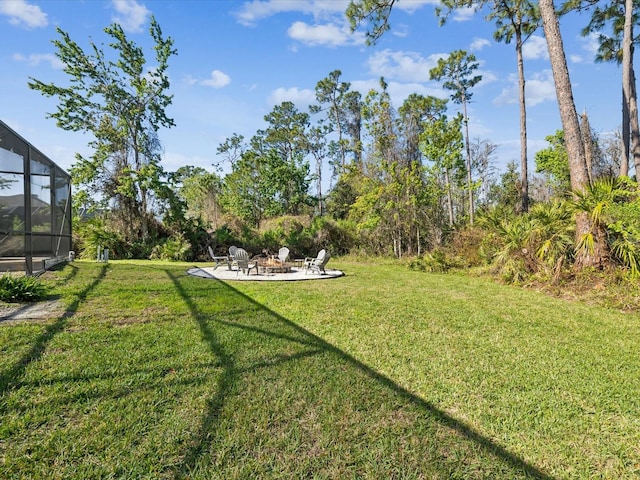 view of yard featuring a lanai and a patio area