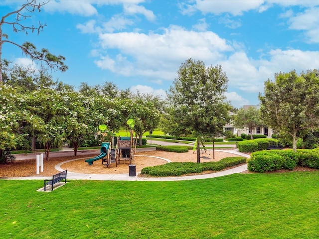 surrounding community featuring a yard and playground community