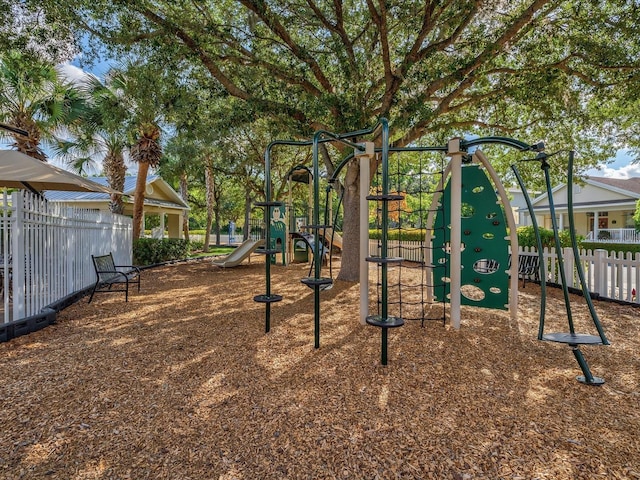 communal playground featuring fence