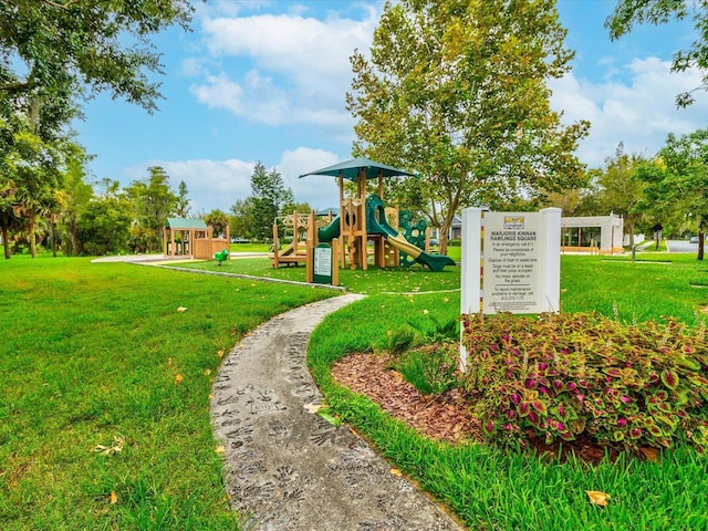 surrounding community featuring playground community and a yard