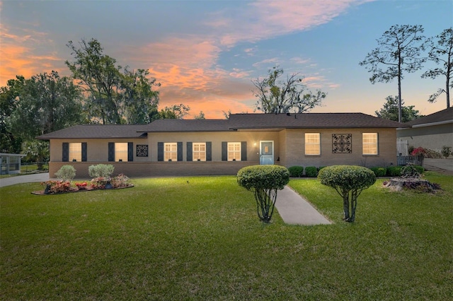 ranch-style house with a yard