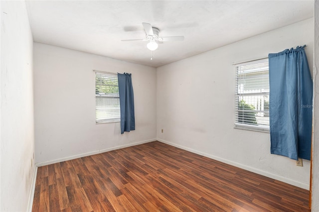 unfurnished room with wood finished floors, baseboards, and ceiling fan