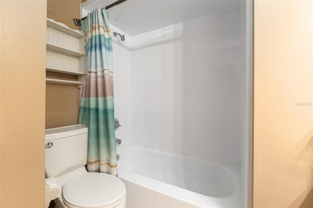 bathroom featuring toilet and shower / tub combo