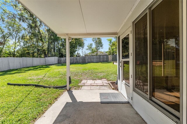 exterior space featuring a patio area and a fenced backyard