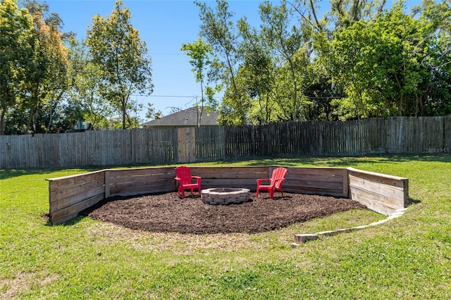 view of yard with a fenced backyard and an outdoor fire pit