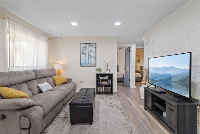 living area featuring recessed lighting and light wood-style floors