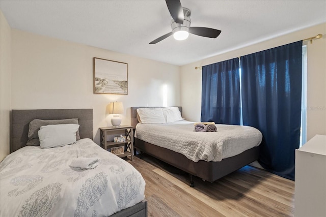 bedroom featuring ceiling fan and wood finished floors