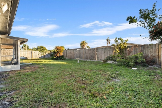 view of yard featuring a fenced backyard