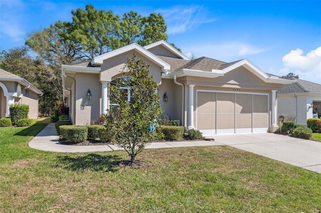 ranch-style house with a front yard, roof with shingles, driveway, an attached garage, and stucco siding