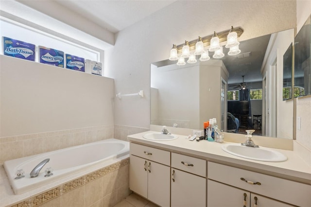 ensuite bathroom featuring ensuite bath, a garden tub, double vanity, and a sink