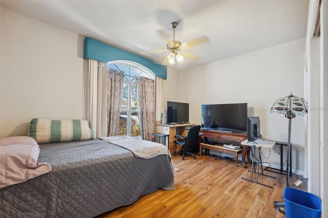 bedroom featuring wood finished floors and ceiling fan
