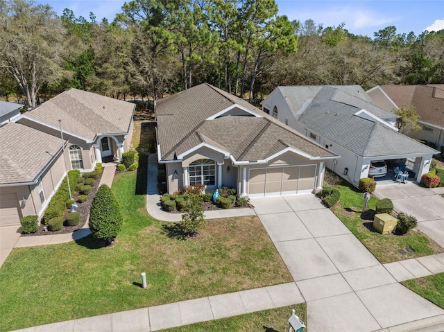 birds eye view of property with a residential view