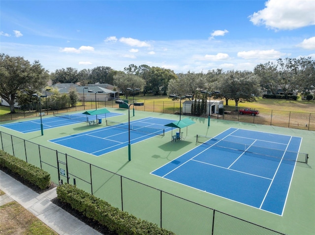 view of tennis court with fence