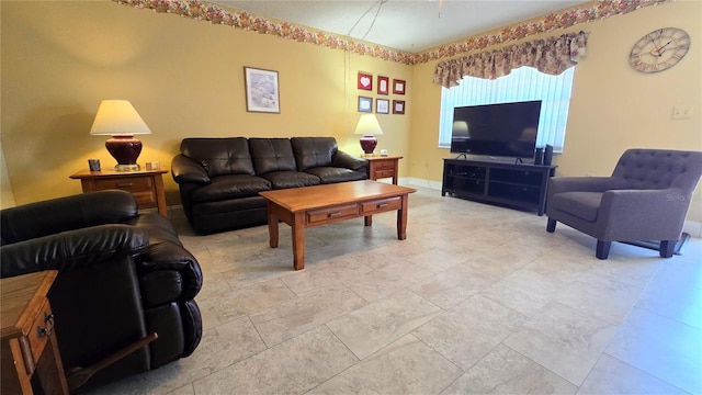 living area featuring baseboards