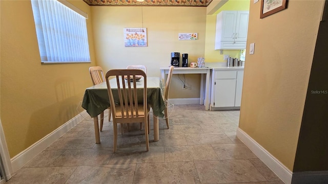 dining room featuring baseboards