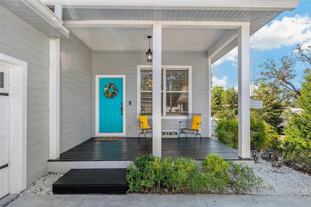 property entrance with covered porch