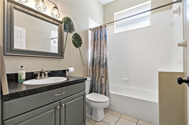 full bathroom featuring vanity, tile patterned floors, toilet, and shower / bath combo with shower curtain