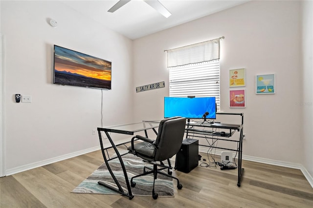 home office with baseboards, a ceiling fan, and wood finished floors