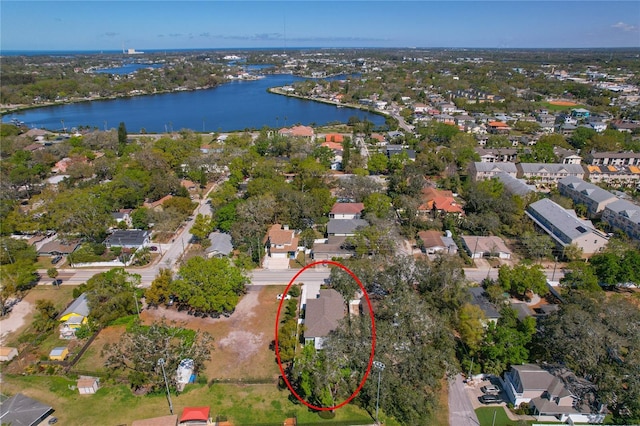 birds eye view of property featuring a residential view and a water view