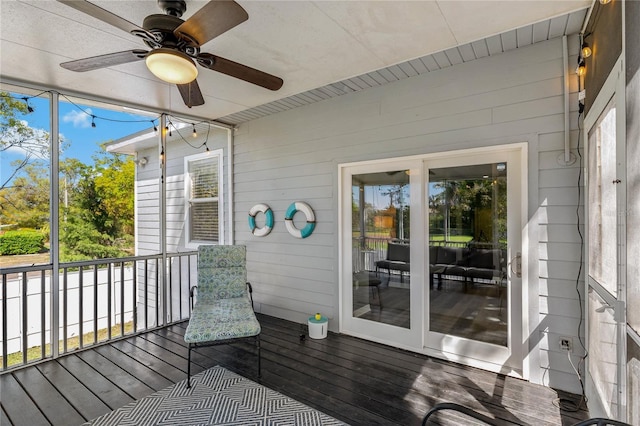 unfurnished sunroom with a wealth of natural light and a ceiling fan