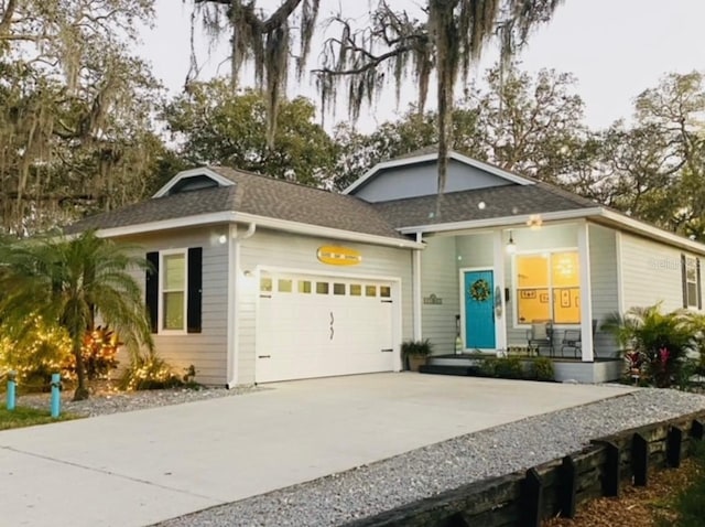 513 Meres Blvd, Tarpon Springs, FL 34689 - ranch-style home with a garage, driveway, and a shingled roof