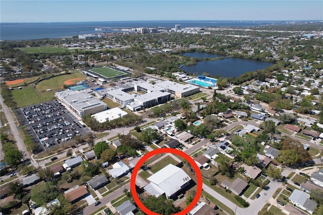 birds eye view of property with a water view