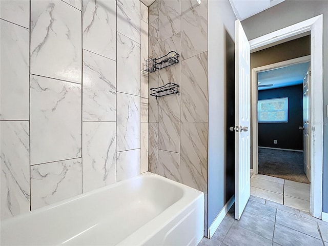 bathroom with baseboards and bathtub / shower combination