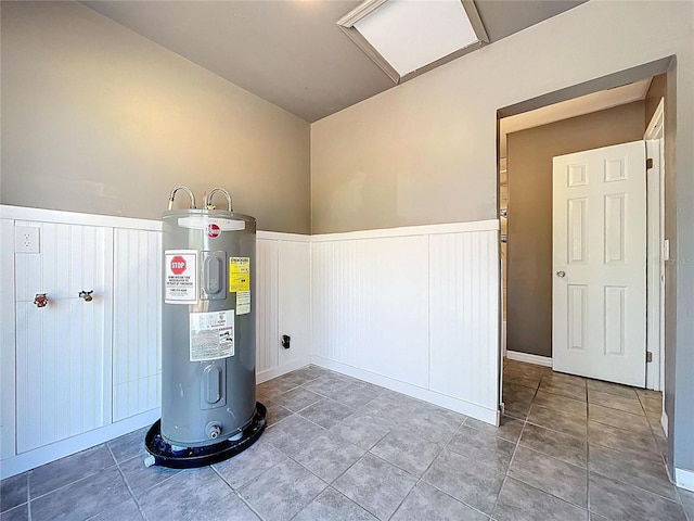 utility room featuring water heater