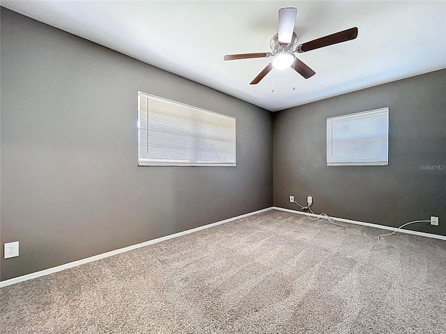 unfurnished room featuring baseboards, a ceiling fan, and carpet flooring