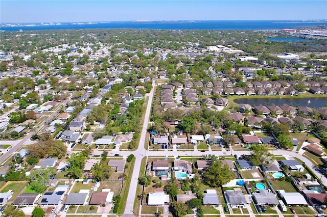 bird's eye view with a residential view and a water view