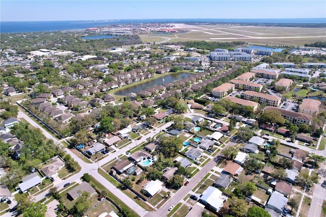 aerial view featuring a water view and a residential view