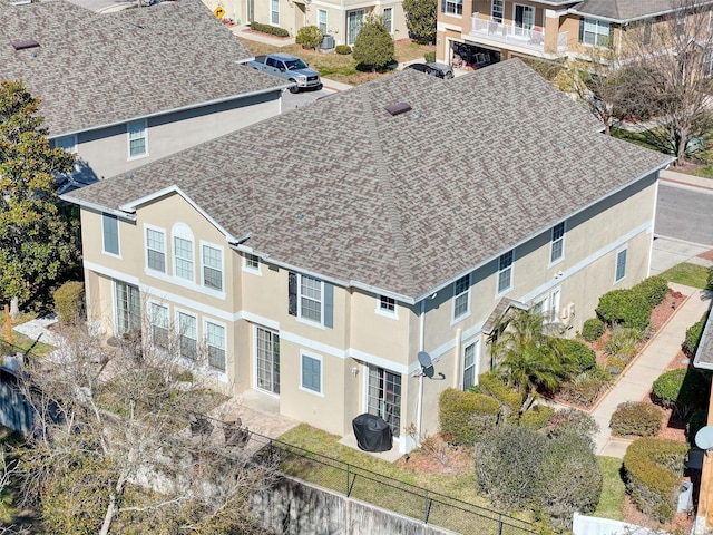 birds eye view of property with a residential view