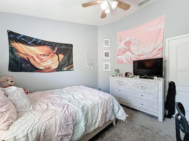 carpeted bedroom with visible vents and a ceiling fan