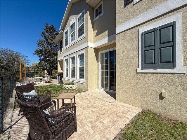 view of patio / terrace featuring fence